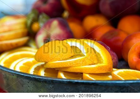 Sliced orange on the plate. Slices of orange on a banquet table.