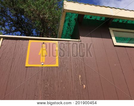 Male Sign Outside An Outdoor Public Toliet
