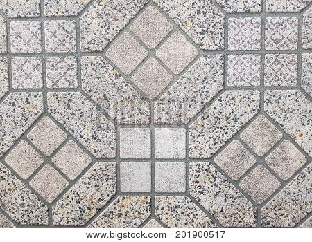Stone pavement texture. Granite cobblestoned pavement background. Abstract background of old cobblestone pavement close-up. Seamless texture. Perfect tiled on all sides