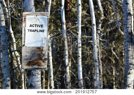 Sign On An Active Trapline In The Woods