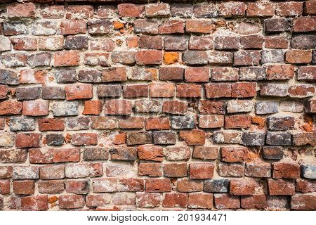 brick wall of an old building in the old town