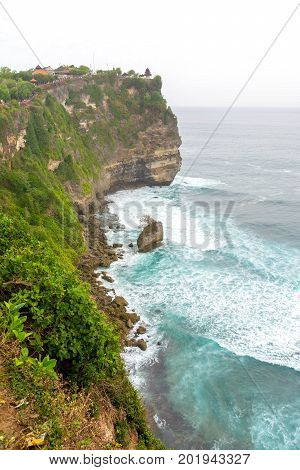 Landscape in Uluwatu Temple Bali Indonesia.
Landscape of high cliff with sunset sky at Uluwatu Temple Bali Indonesia.