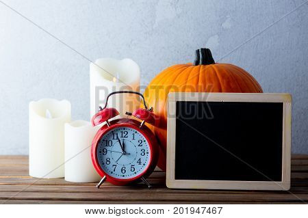 Pumpkin And Candles With Menu Blackboard
