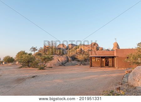 HOADA NAMIBIA - JUNE 27 2017: The reception office at the Hoada Camp in the Kunene Region of Namibia. The swimming pool and bar is on the hill