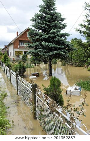 The consequences of flooding, flooded house and yard