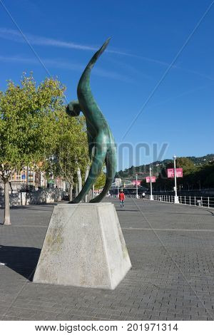 BILBAO, SPAIN - AUGUST 17, 2017: The Conmemoracion Al Dia Del Mar Statue on the Riverwalk in Bilbao, Spain. The sculpture is by Vicente Vazquez Canonico.