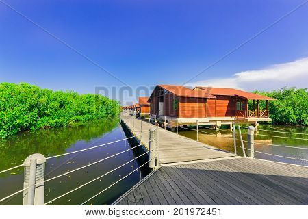 Cayo Coco island, Cuba, Iberostar Mojito resort, July 17, 2017, gorgeous, amazing inviting view of hotel grounds with villa houses standing in natural sea water in tropical garden on sunny great day