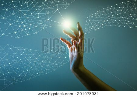the hand is touching hologram to connect to artificial intelligent system Abstract technology concept about internet of thing.