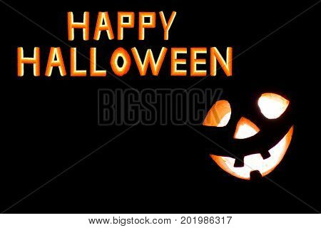 HappyHalloween pumpkin with scary face on black backgound