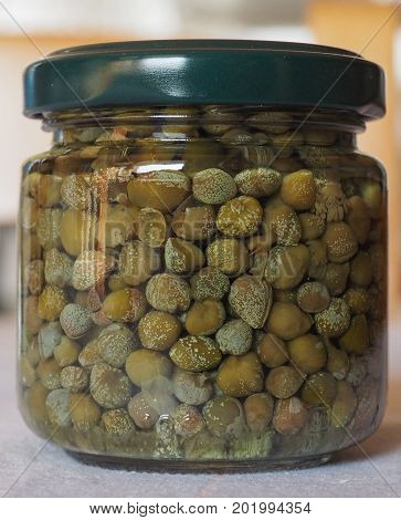 green caper (Capparis spinosa) fruit vegetarian salted food in a jar