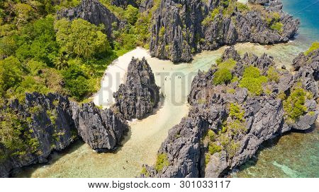 El Nido Palawan National Park Philippines. Warm Hidden Lagoon Near The Rocks. Tourists Relax On The 