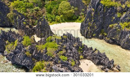 El Nido Palawan National Park Philippines. Warm Hidden Lagoon Near The Rocks. Tourists Relax On The 