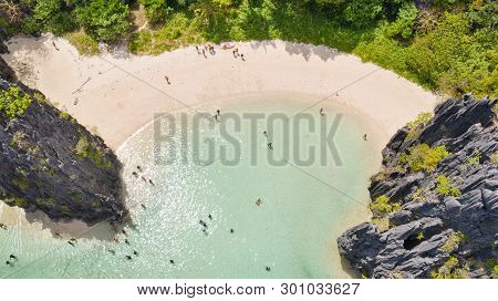 El Nido Palawan National Park Philippines. Warm Hidden Lagoon Near The Rocks. Tourists Relax On The 