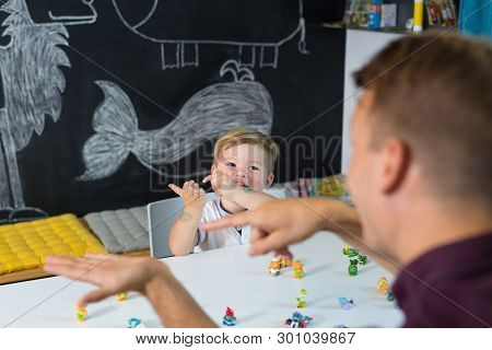 Cute Little Toddler Boy At Speechtherapist Session.