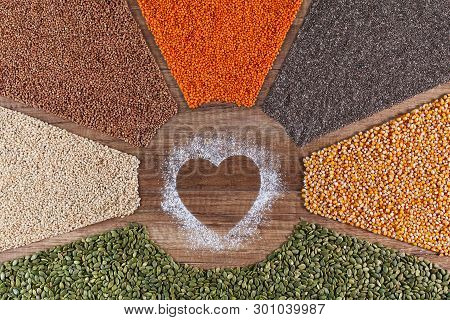 Food With Love - Plant Based Diversified Diet Concept With Colorful Grains And Seeds Surrounding Hea