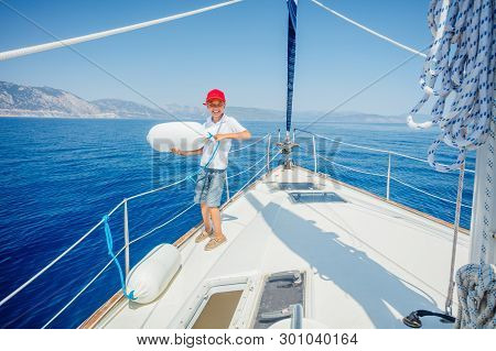 Little Boy On Board Of Sailing Yacht On Summer Cruise. Travel Adventure, Yachting With Child On Fami