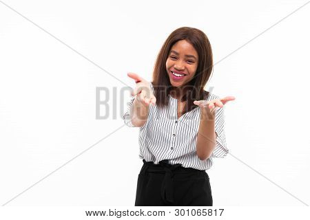 Portrait Of African Young Girl Possing And Gesticulates Hands On Background