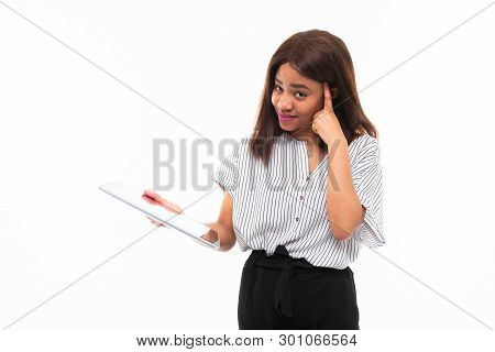 Portrait Of African Young Girl Possing With Grey Tablet In Hands On Background