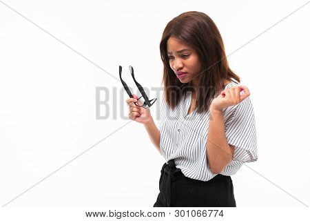 Portrait Of Attractive Young Afro-american Girl Possing With Glasses On Background