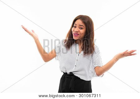 Portrait Of African Young Girl Possing And Gesticulates Hands On Background