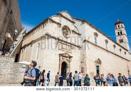 Dubrovnik, Croatia - April, 2018: Tourists At The Church Of St. Spasa Located At Stradun Street In T
