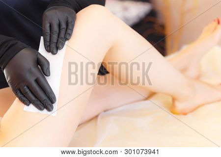 Waxing Bikini Area. Young Woman Depilating Bikini Area With Wax.