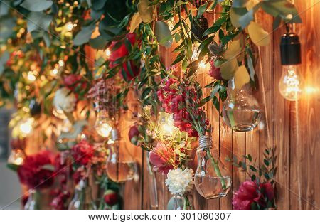 Rustic Wedding Photo Zone. Hand Made Wedding Decorations Includes Photo Booth  Red Flowers. Garlands
