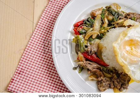 Fried Rice With Basil Leaves And Red Cloth On The Table.ngredients Of Basil Fried Chicken And Fried 