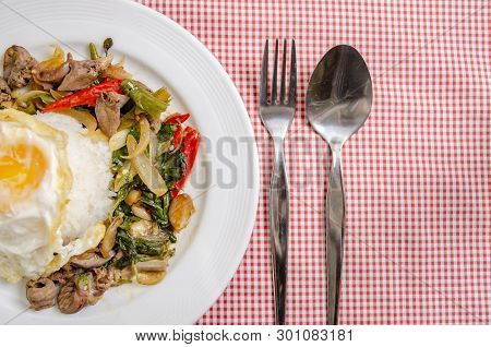 Fried Rice With Basil Leaves And Red Cloth On The Table.ngredients Of Basil Fried Chicken And Fried 
