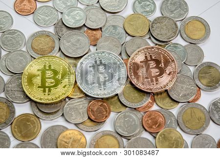 Gold, Silver And Bronze It Is A Digital Currency With Thai Baht Coins Placed On A White Background.s