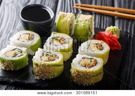 Green Japanese Roll With Avocado, Tamago Omelette, Sesame And Cucumber Closeup On A Plate. Horizonta