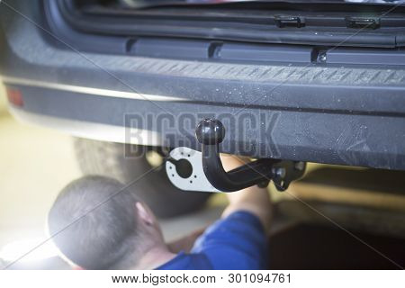 Towbar On The Car. Installation Of The Trailer Device On The Car.