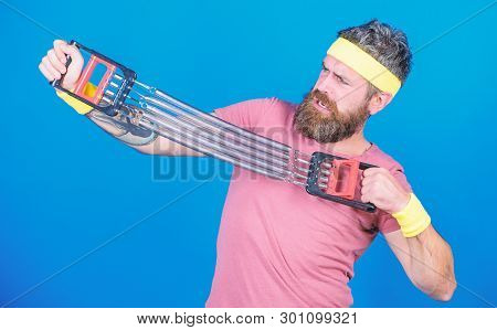 Guide Used Expander Proper Way. Sportsman Stretching Expander. Try Stretching Exercise. Athlete Work