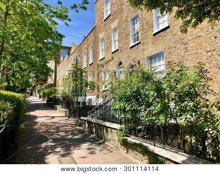 HAMPSTEAD, LONDON - MAY 14, 2019: Attractive terraced houses on Flask Walk in Hampstead, North London, UK.