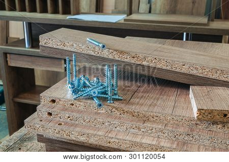 Furniture Fittings, Confirmatory Fasteners On Workpieces Made Of Chipboard, Close-up