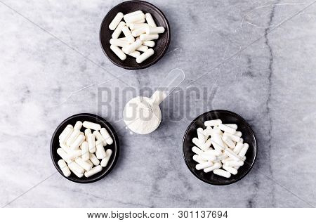 Scoop Of Whey Protein, Hydrolyzed Collagen Type I, L-proline And L-lysine Capsules. Supplements To S