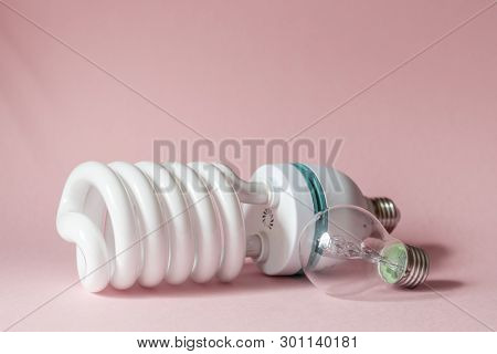 Close Up View Of White Light Bulb Isolated On Pink.