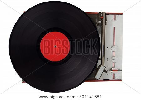 Vintage Turntable Playing Vinyl Close Up. Retro Ecord Player Writh Vinyl Record.