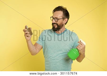 Right Perfume Fragrance Makes You Feel Fresh. Man Bearded Handsome Smiling Face Hold Bottle Perfume 