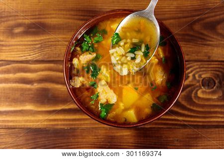 Kharcho Soup With Meat And Rice On Wooden Table. Top View
