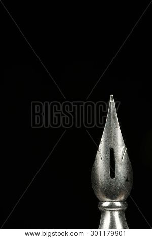 Macro Image Of A Pen Nib Against A Black Background