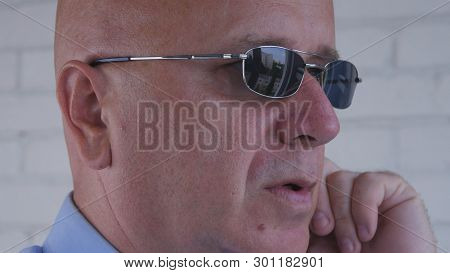 Confident Bodyguard Image Using Discreet Ear Phones For Communication