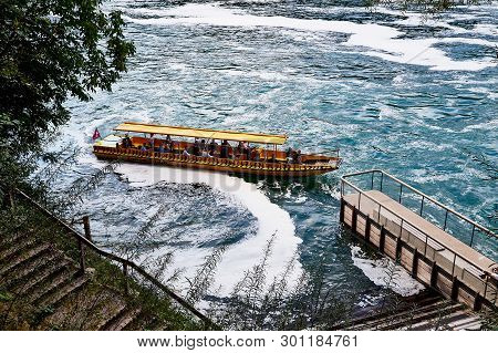 Rhine, Switzerland - September 19, 2018: Tourist Ship On The Rhine River Near The Rhine Falls In Swi