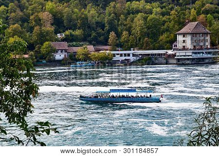 Rhine, Switzerland - September 19, 2018: Tourist Ship On The Rhine River Near The Rhine Falls In Swi