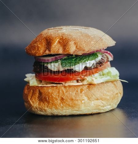 Burger Flyer. Cheese Burger With Grilled Meat, Cheese, Salad And Onion Rings. Close-up Of Delicious 