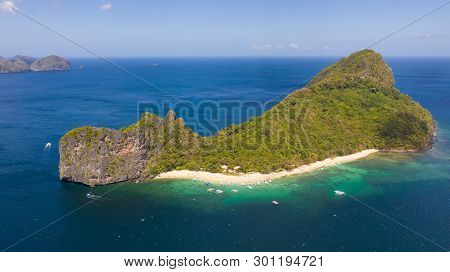 Tourists Relax On The White Beach Of The Island Of Helikopter.tropical White Sand Beach. Seascape Wi