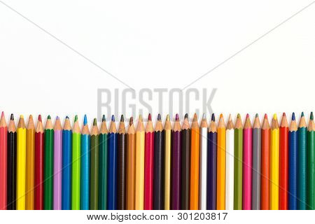 Colour Pencils Isolated On White Background. Wood Texture Pencil With Sharpening Shavings On White B