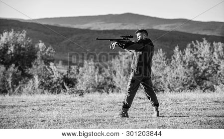 Hunter With Rifle Looking For Animal. Hunting Shooting Trophy. Man Rifle For Hunt. Mental Preparatio
