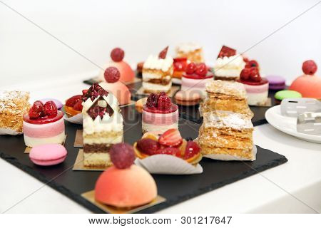 Desserts With Fruits, Mousse And Biscuits On Plate
