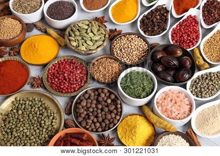 Aromatic Spices And Herbs In Metal And Ceramic Bowls. Top View.